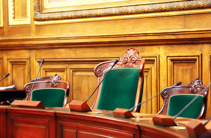 Empty vintage court's room with table,chairs and microphones.